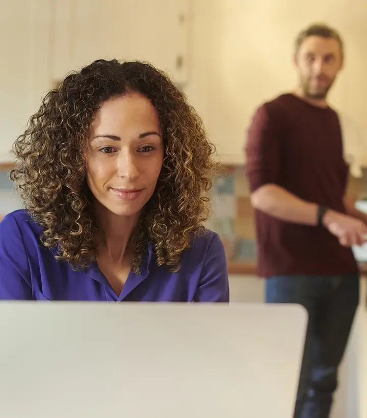 Man watching woman on laptop